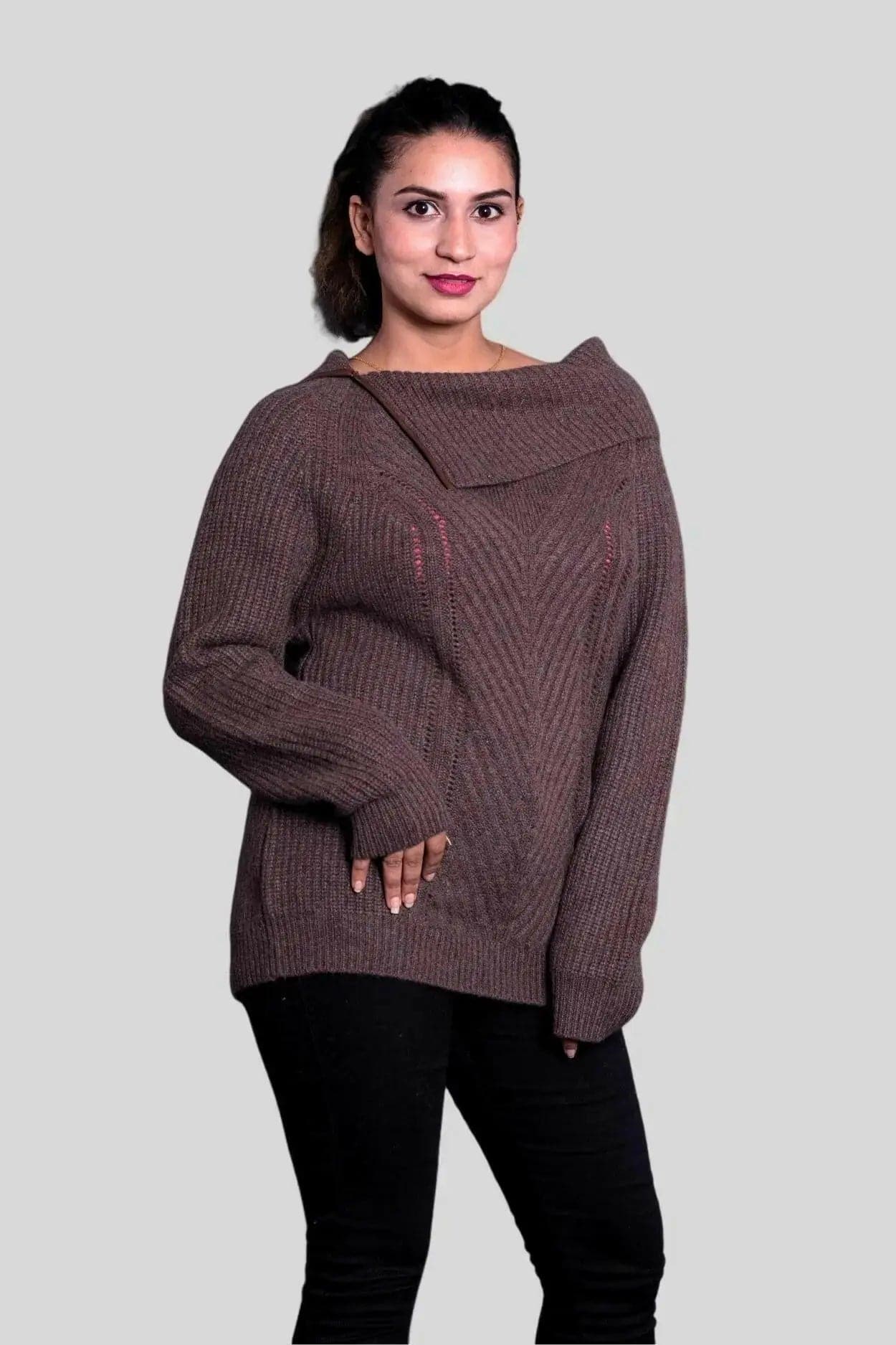 Woman wearing a brown roll neck pullover from KCI 291 collection