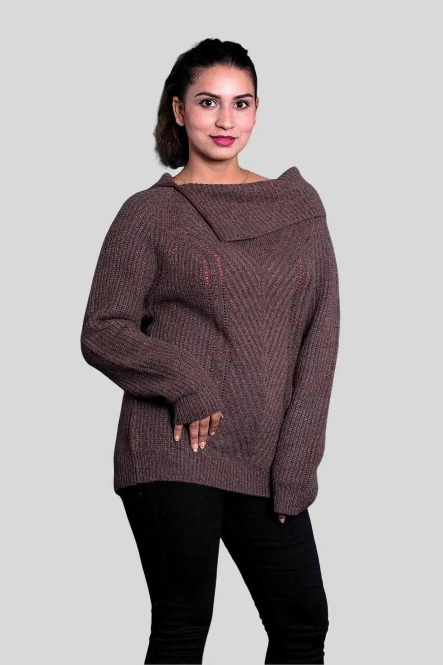 Woman wearing a brown roll neck pullover from KCI 291 collection