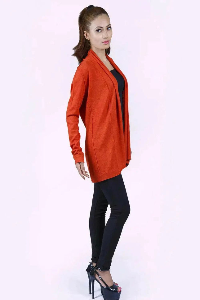 Stylish woman in red jacket and black pants showcasing the Luxurious Ashley Open Knit Cashmere Cardigan