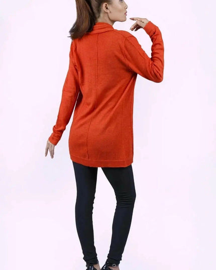 Luxurious Ashley Open Knit Cashmere Cardigan styled by woman in orange sweater and black pants