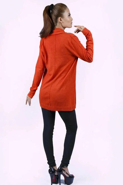 Luxurious Ashley Open Knit Cashmere Cardigan styled by woman in orange sweater and black pants