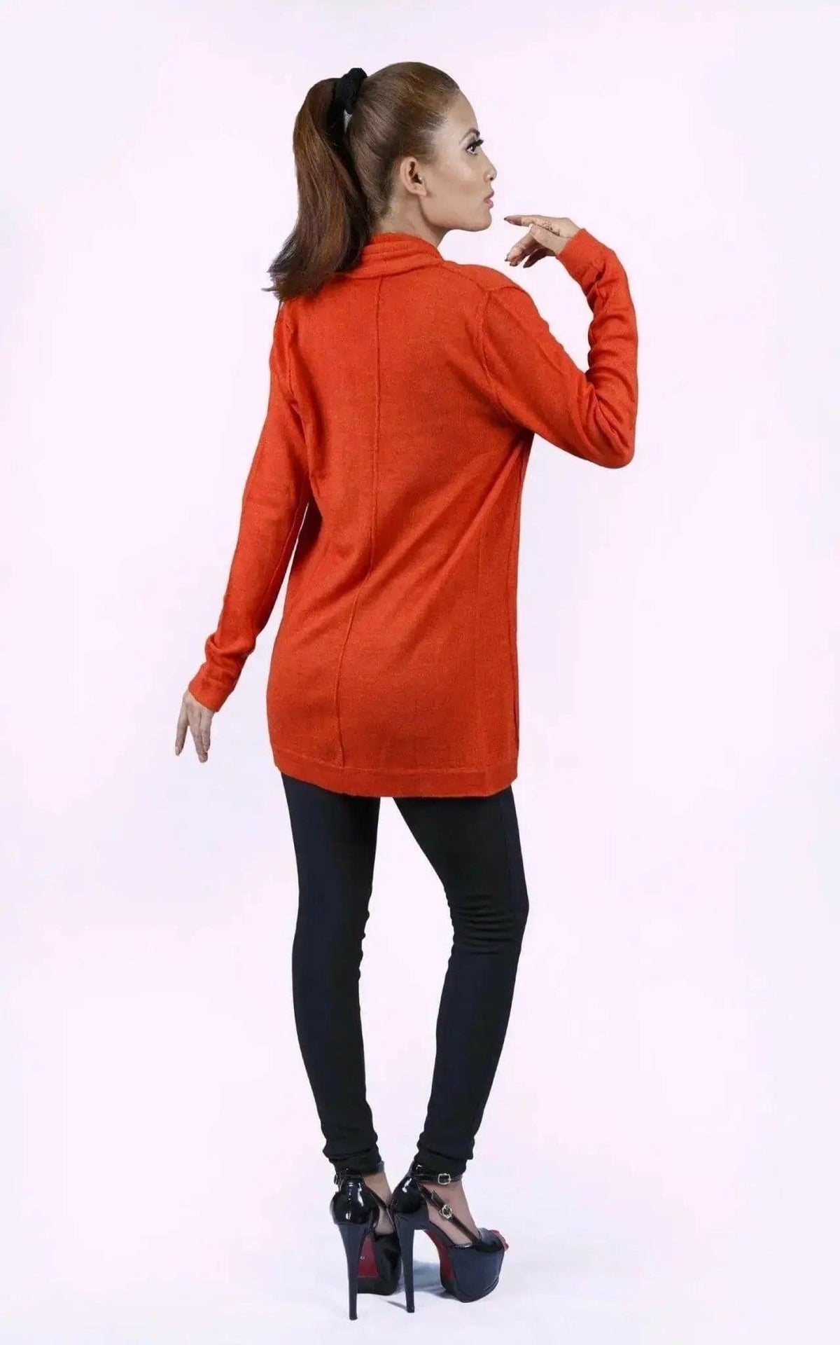 Luxurious Ashley Open Knit Cashmere Cardigan styled by woman in orange sweater and black pants