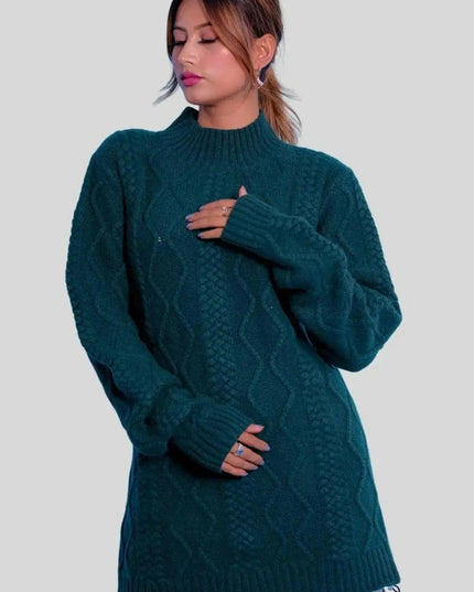 Stylish woman in green sweater and grey pants, showcasing Luxurious Cashmere Cable Dress