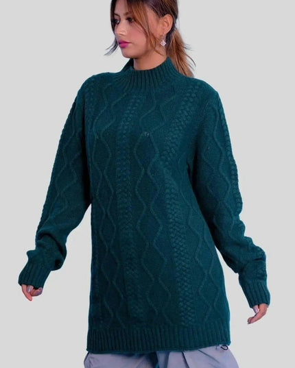 Woman in green sweater and grey pants modeling Luxurious Cashmere Cable Dress
