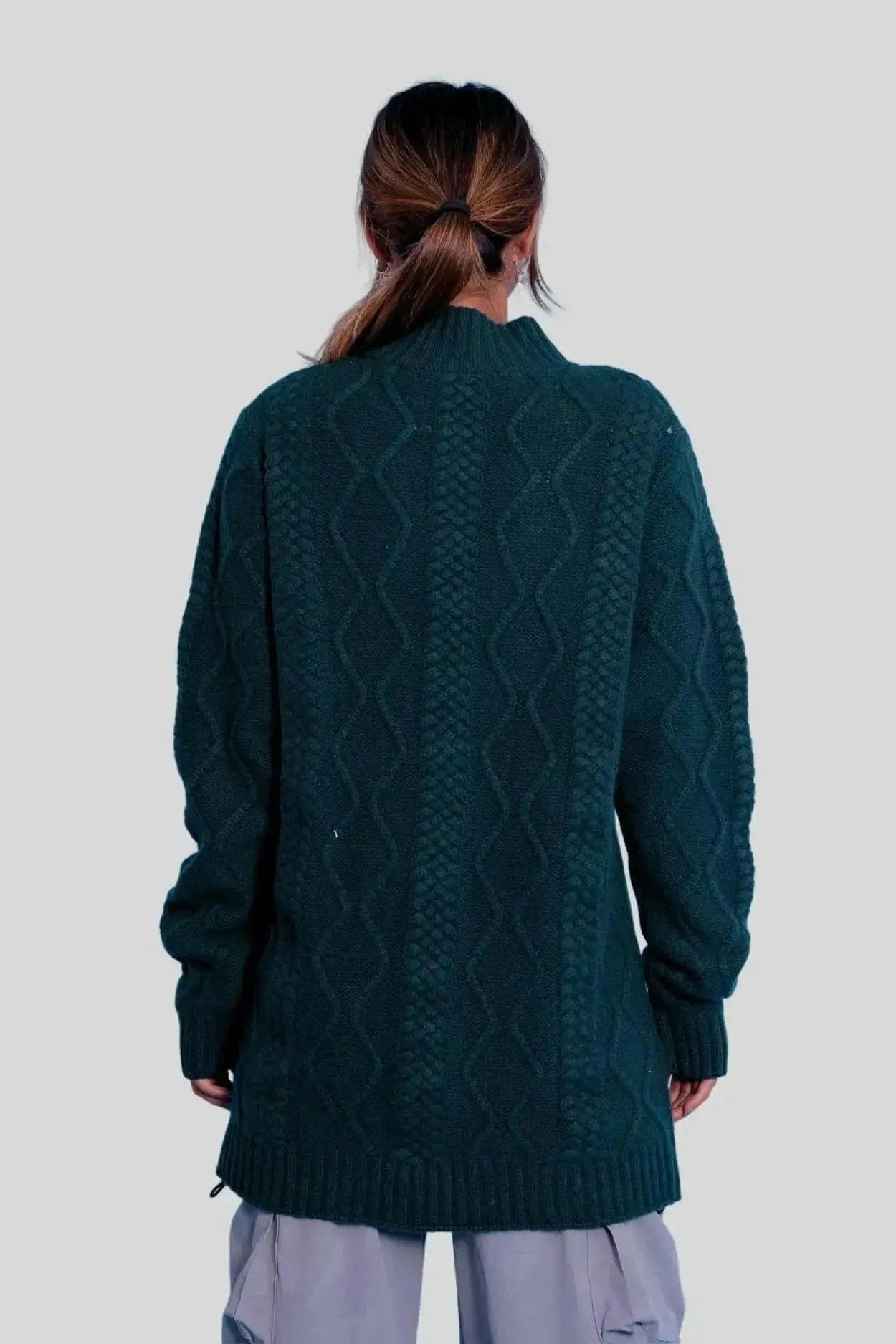 Woman in green cashmere cable dress