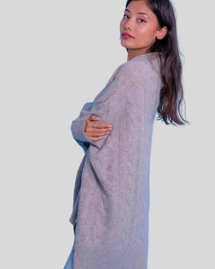 Luxurious Cashmere Oversized Cable Pullover featuring woman in grey sweater and jeans