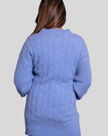 Woman in blue cashmere cable pullover