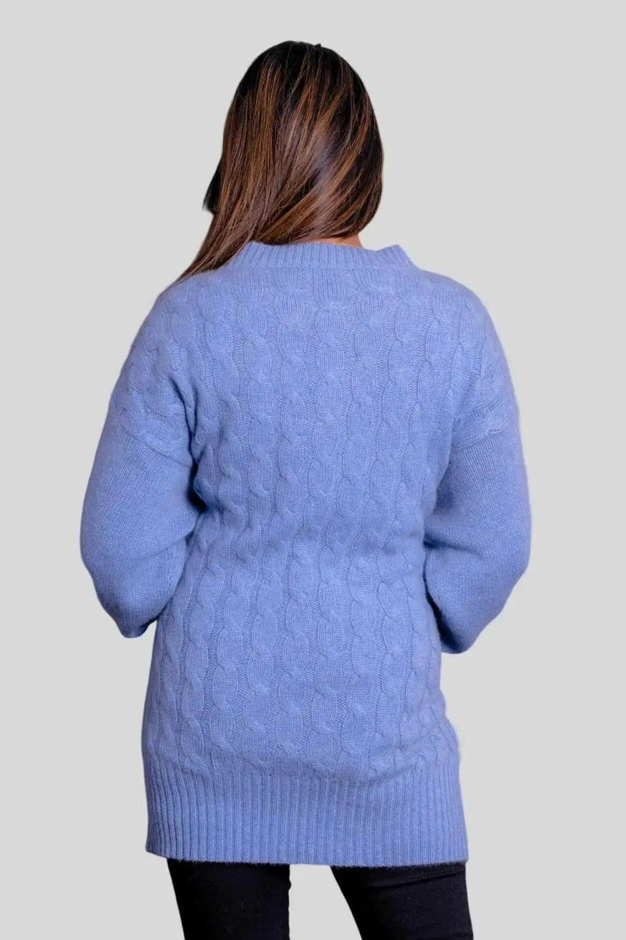 Woman in blue cashmere cable pullover