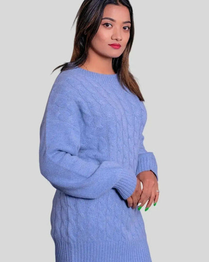 Woman in blue cashmere cable pullover