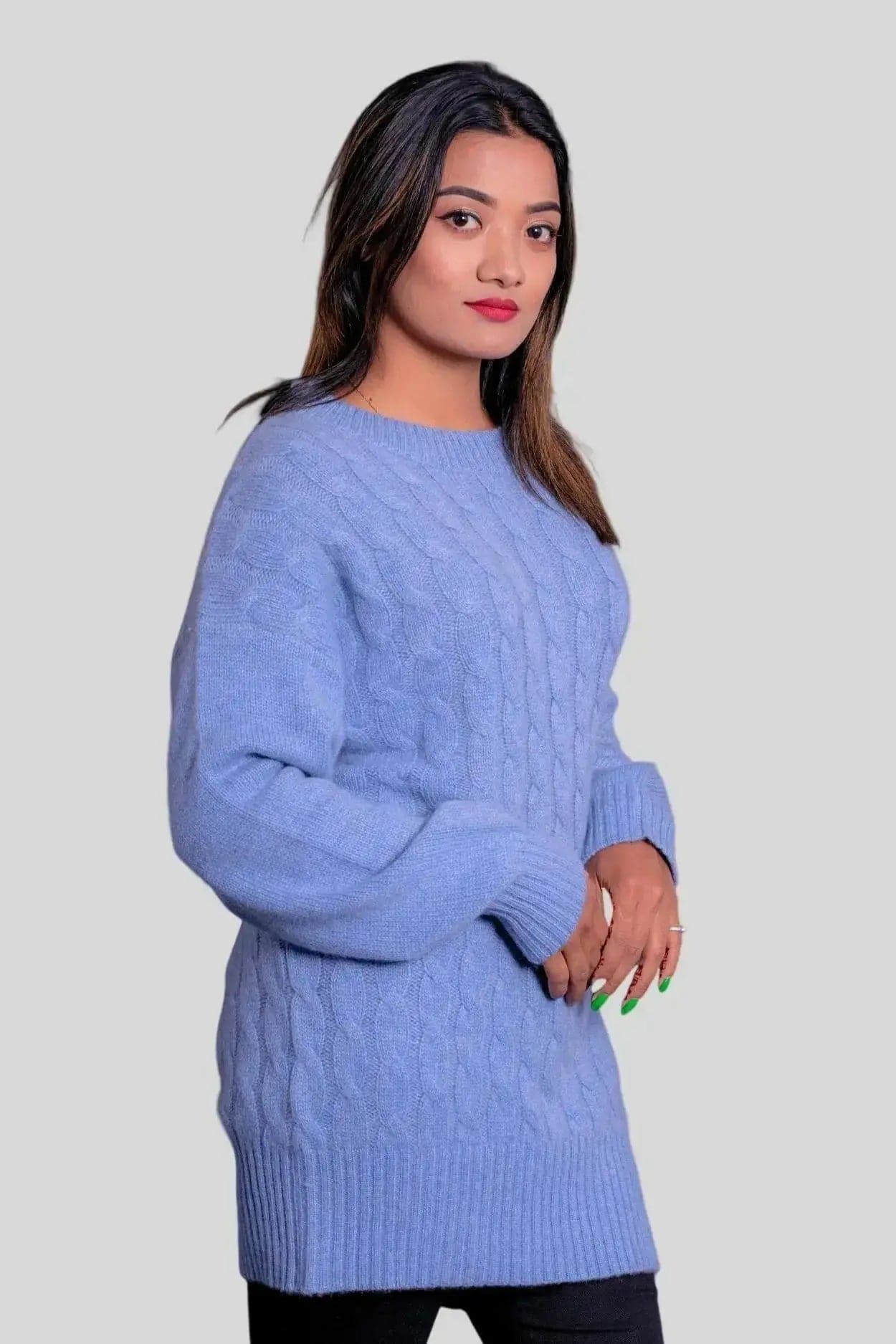Woman in blue cashmere cable pullover