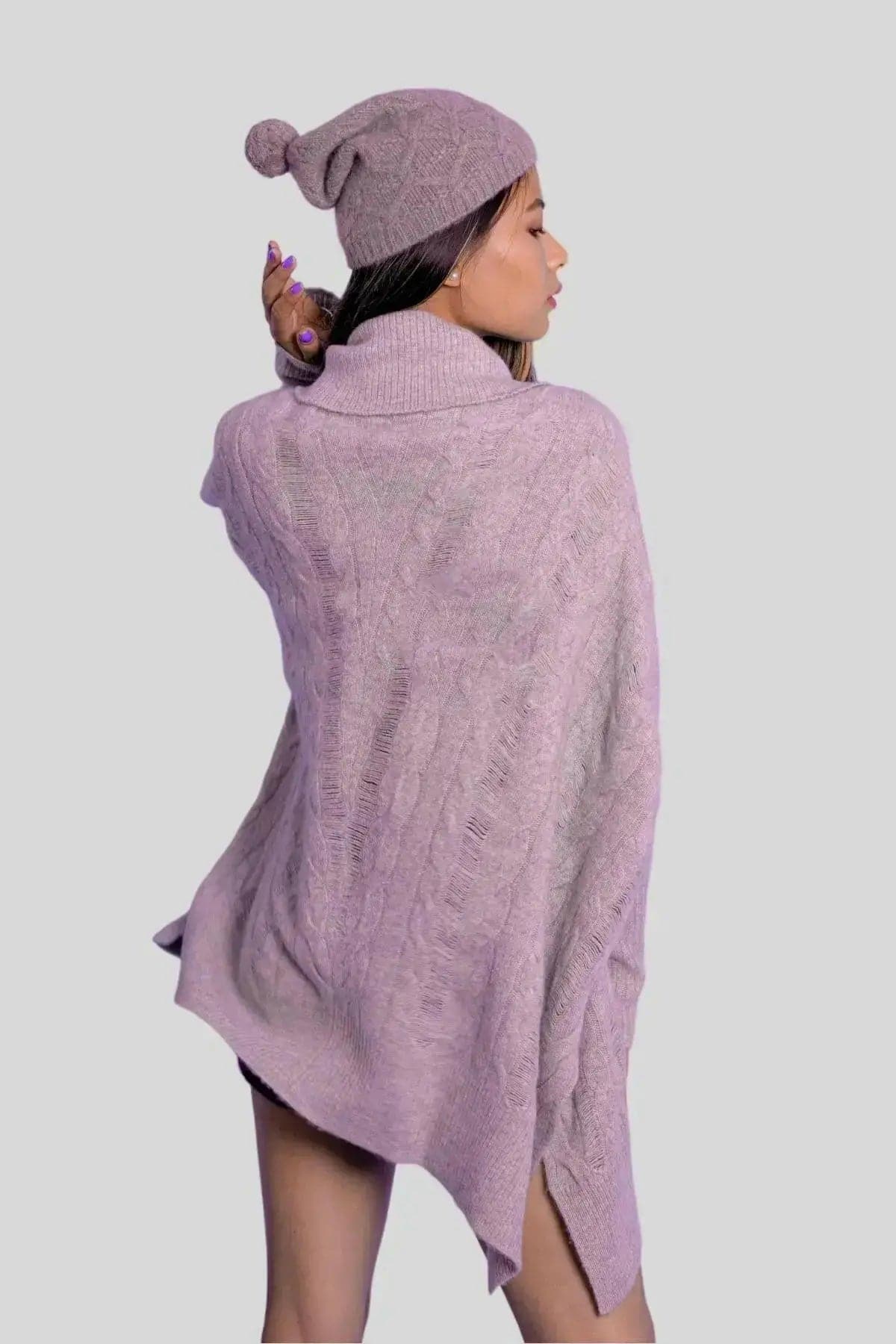 Woman in purple cashmere cable pullover and hat