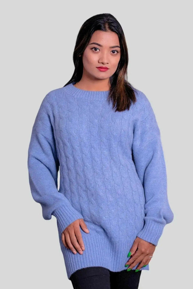 Woman in luxurious blue cashmere cable pullover