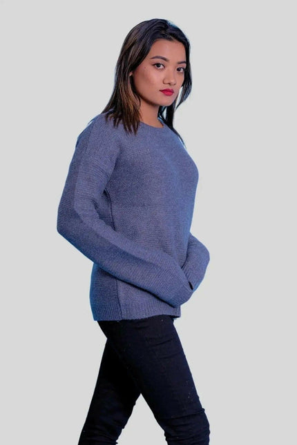 Luxurious Cashmere Ribbed Pullover featuring a woman in a blue sweater and black jeans