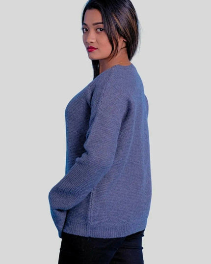 Luxurious cashmere ribbed pullover featuring a woman in blue sweater and black jeans
