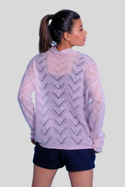 Luxurious cashmere silk pointelle pullover on woman in pink sweater