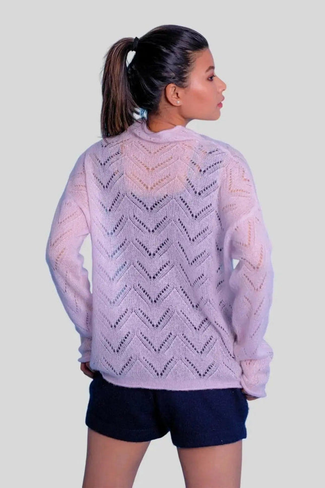 Luxurious cashmere silk pointelle pullover on woman in pink sweater