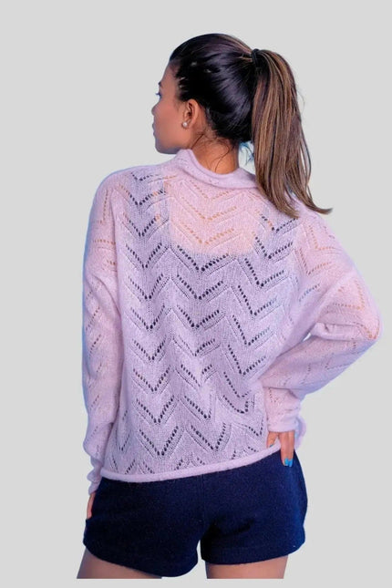 Luxurious cashmere silk pointelle pullover on woman in pink sweater