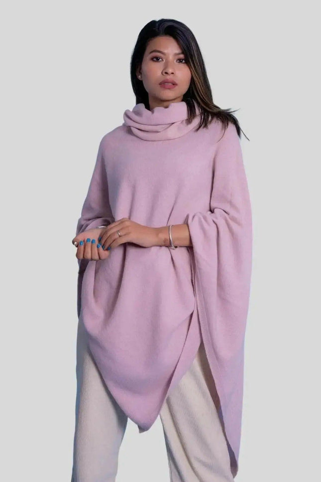 Luxurious Cashmere Turtle Neck Poncho - Woman in Pink Poncho with Hands on Hips