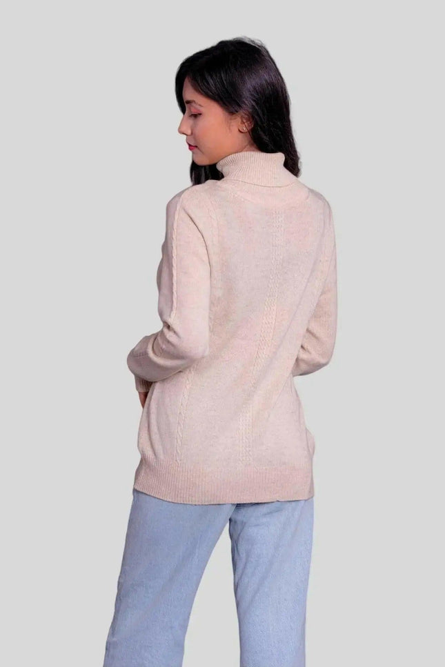 Woman showcasing luxurious Cashmere Turtleneck Pullover in pink sweater and jeans