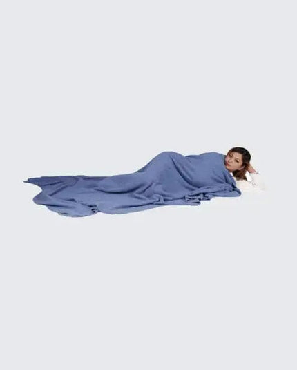 Woman laying on ground with head down, experiencing ultimate luxury with Luxurious Dark Gray Blue Cashmere Blanket