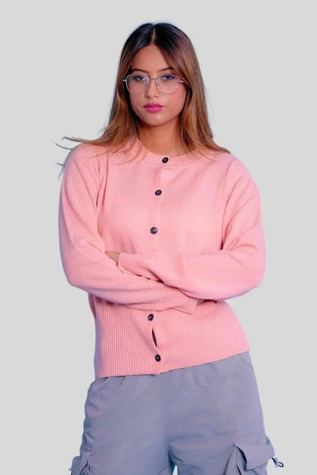 Woman wearing pink cashmere button cardigan
