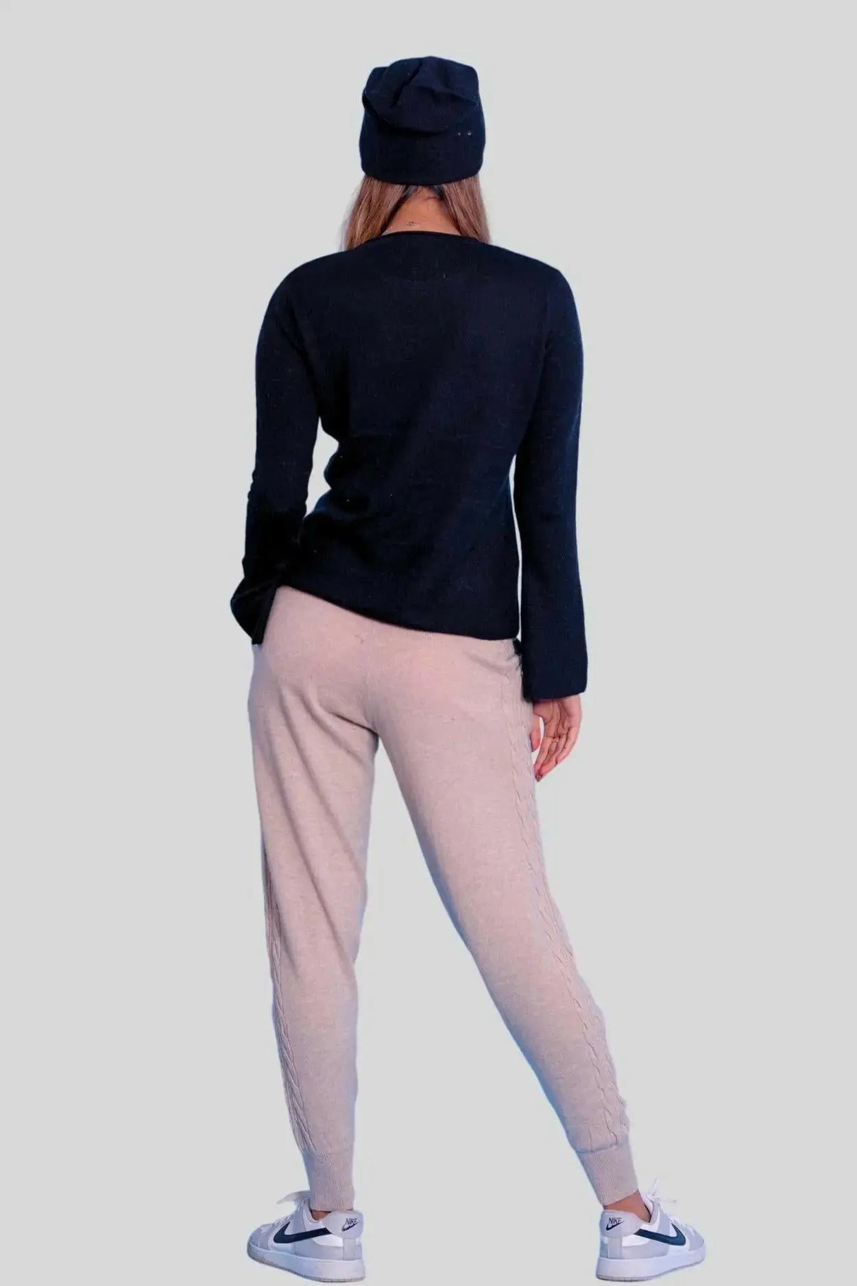 Luxurious Italian Cashmere Cable Trouser - Woman in Black Sweater and Beige Pants