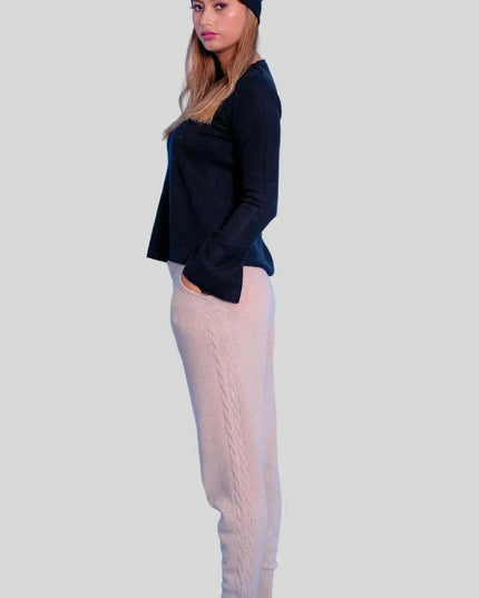 Luxurious Italian Cashmere Cable Trouser featuring woman in black sweater and beige pants
