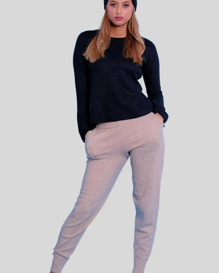 Luxurious Italian Cashmere Cable Trouser: Woman in black sweater and grey sweat pants