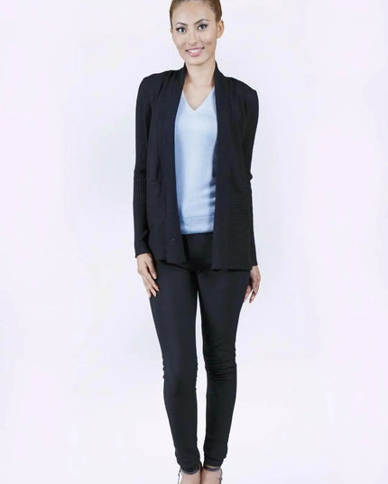 Elegant woman in black suit and blue top wearing luxurious Italian Cashmere Cardigan