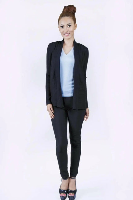 Elegant woman in black suit and blue top wearing luxurious Italian Cashmere Cardigan