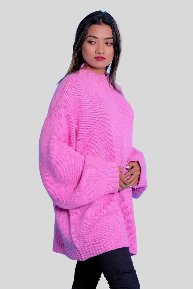 Woman in pink sweater and black jeans modeling Luxurious Italian Cashmere Crew Neck Sweater