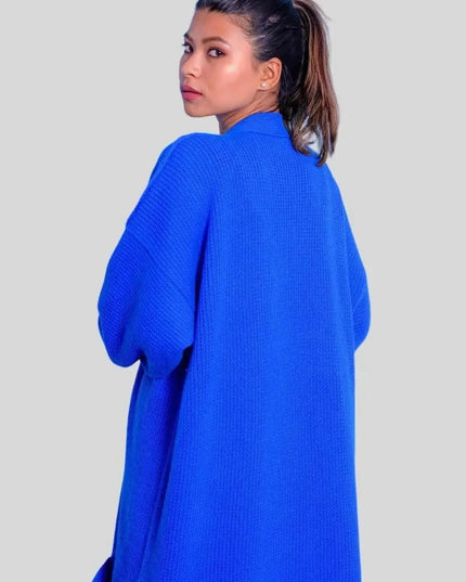 Luxurious cashmere long open cardigan worn by woman in blue sweater and jeans
