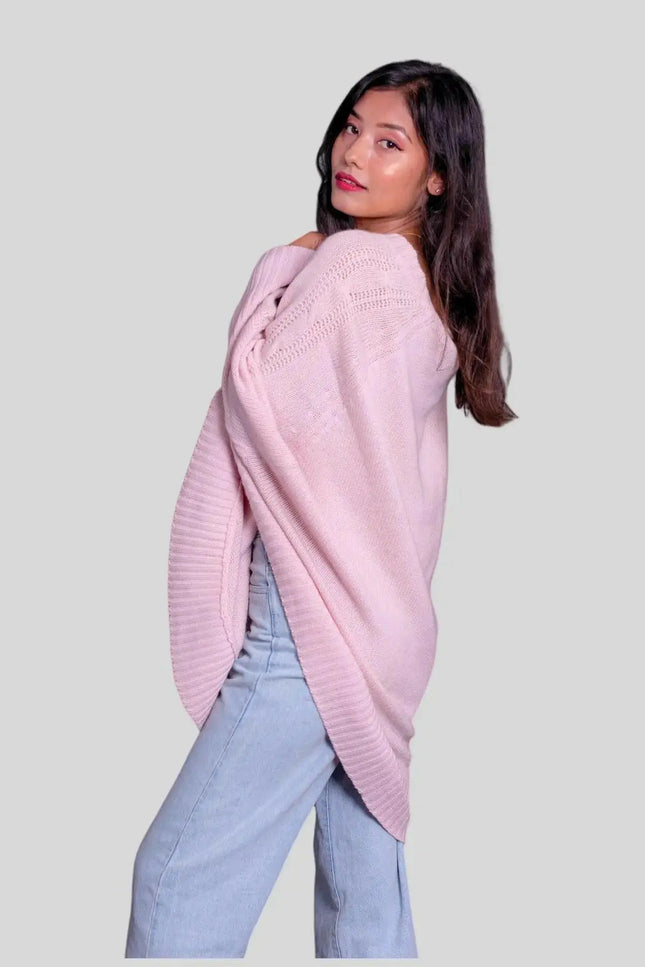 Luxurious Italian cashmere women’s poncho in pink sweater and jeans outfit