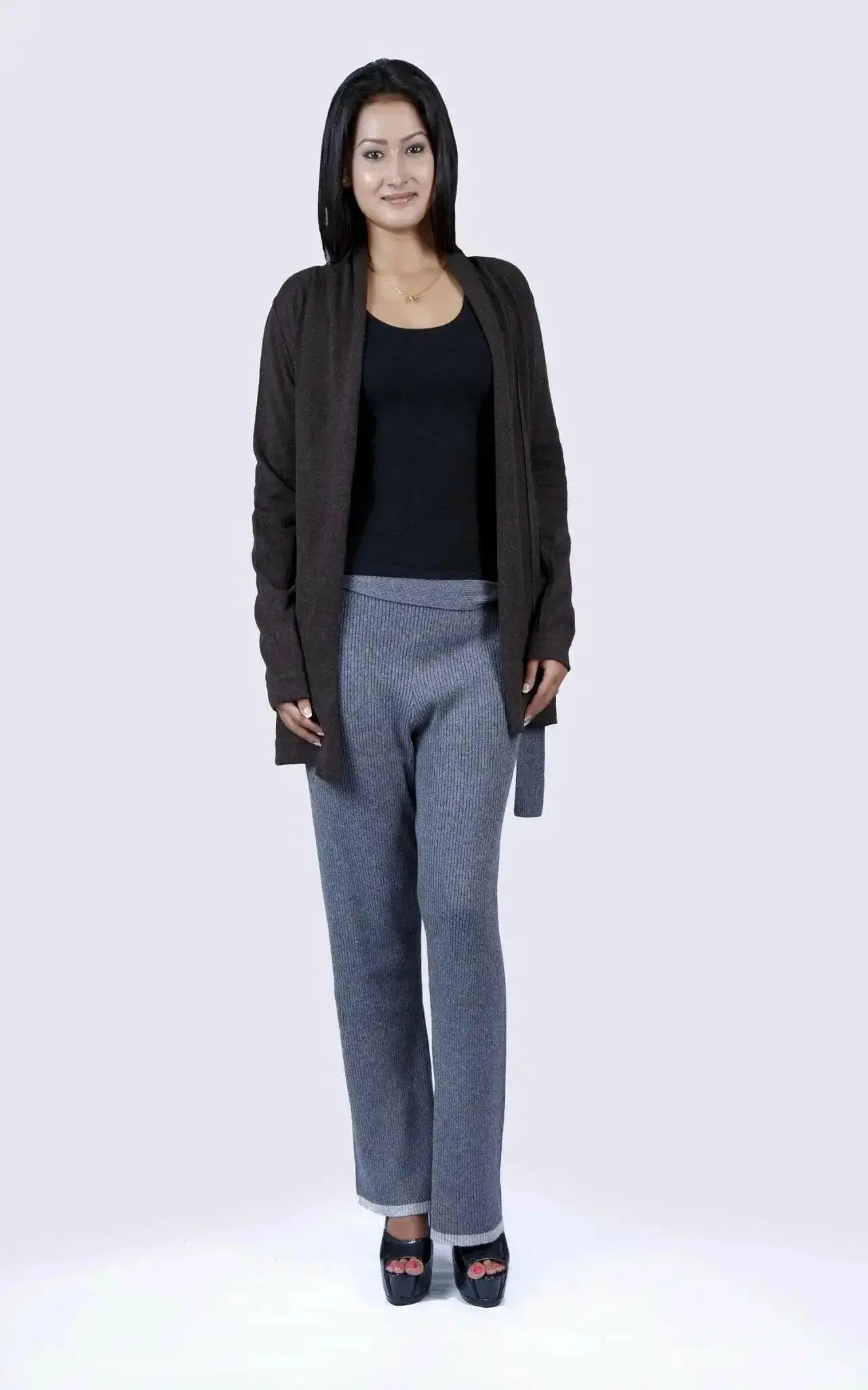 Woman in black top and grey pants wearing Luxurious Italian Cashmere Ribbed Bottom with Mid Rise Waistline