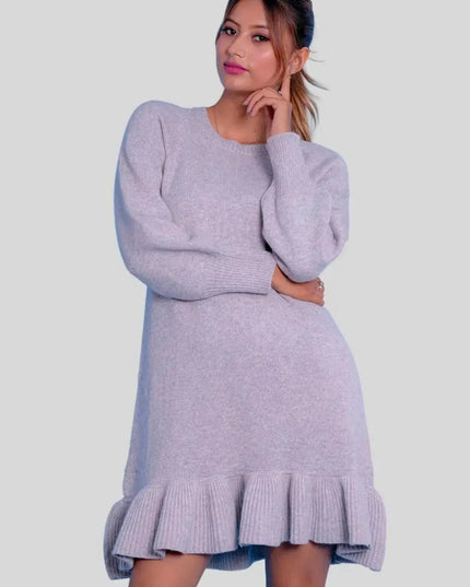 Woman in grey cashmere ruffle dress