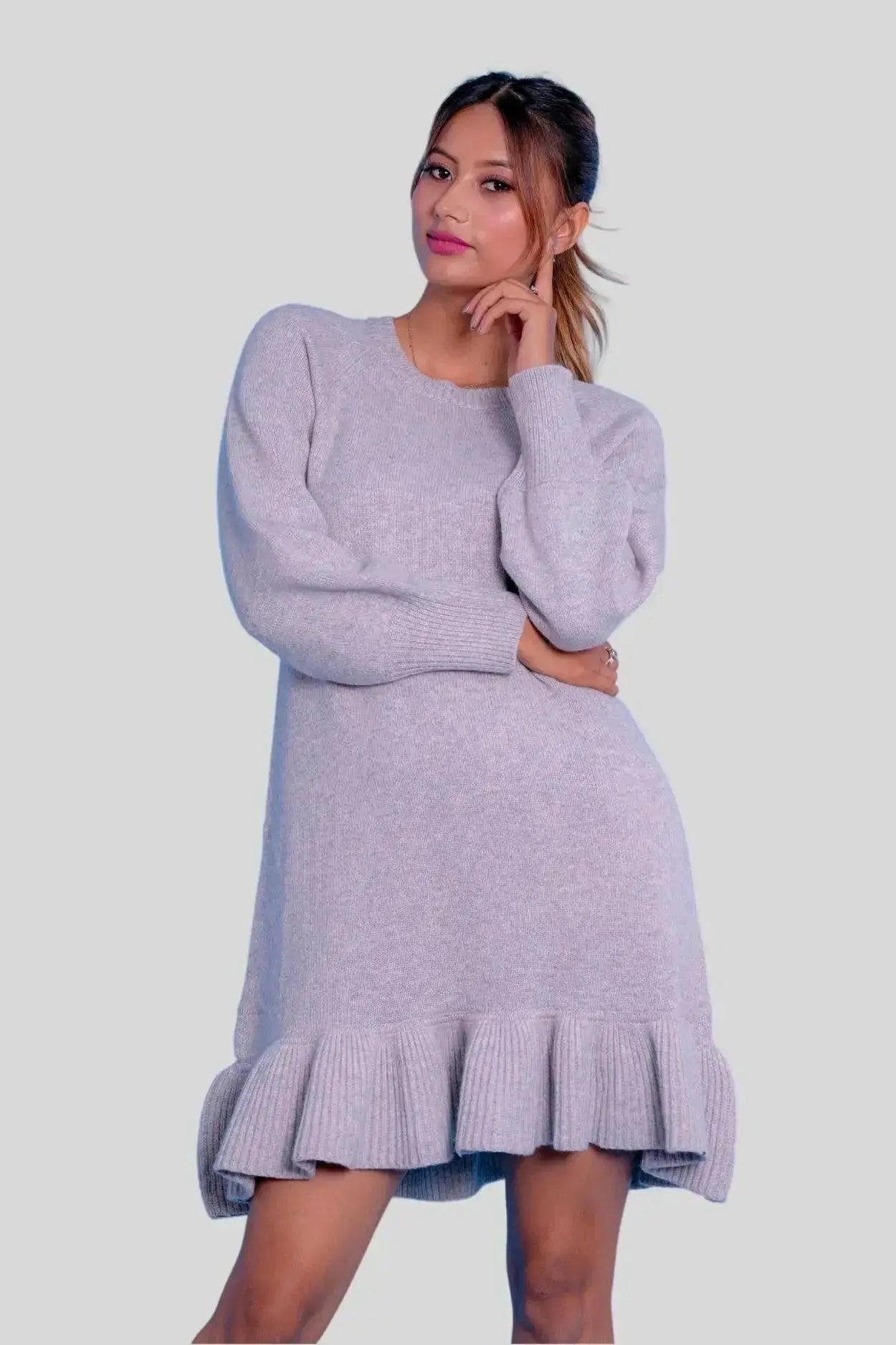 Woman in grey cashmere ruffle dress