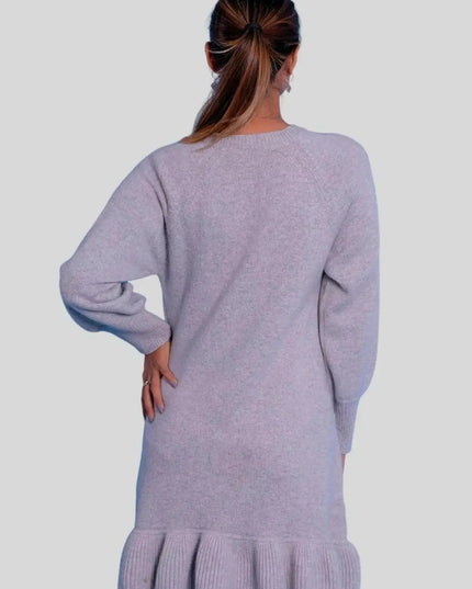 Woman wearing a grey cashmere ruffle dress