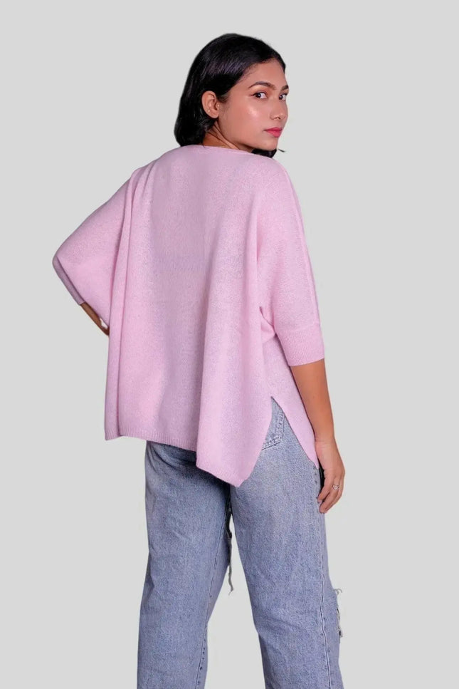 Fashionable woman in pink sweater and jeans wearing Luxurious Italian Cashmere Scarf