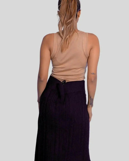 Luxurious Italian Cashmere Skirt featuring a woman in black skirt and tan top