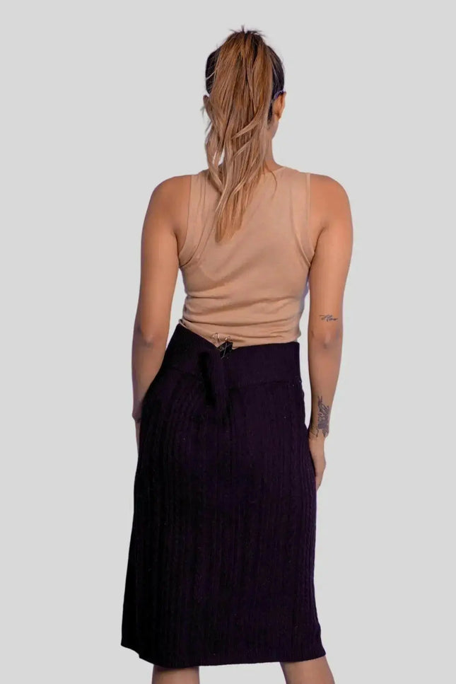 Luxurious Italian Cashmere Skirt featuring a woman in black skirt and tan top