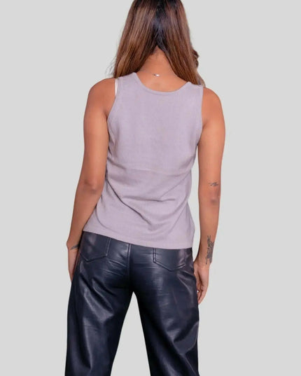 Woman in luxurious Italian cashmere top with flattering fit and black leather pants