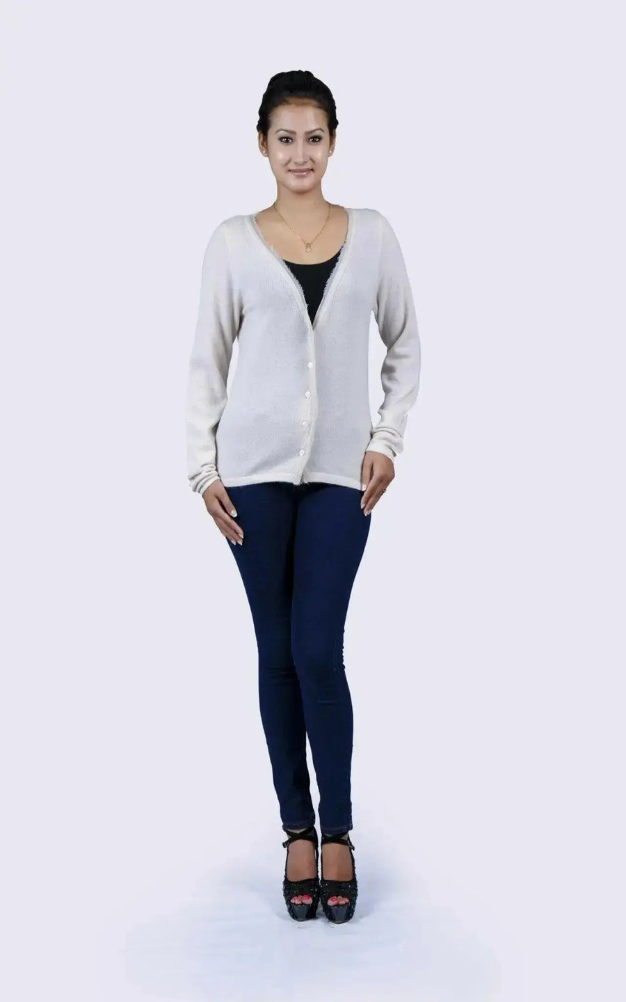 Woman in luxurious Italian cashmere V-neck sweater and jeans