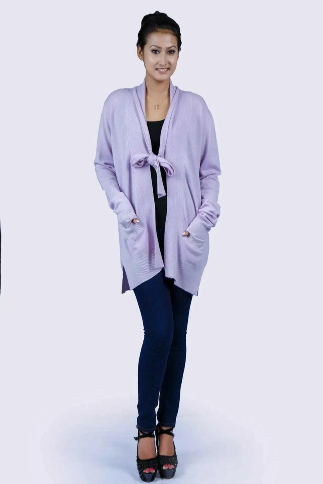 Woman wearing luxurious purple shawl collar pocket cardigan in jeans