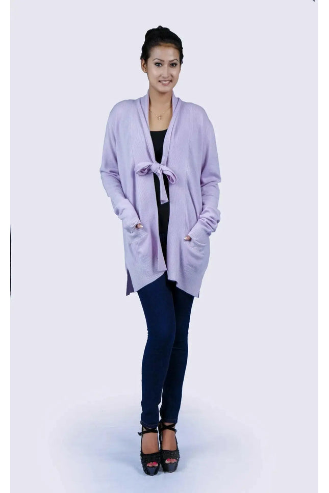 Woman wearing luxurious purple shawl collar pocket cardigan in jeans