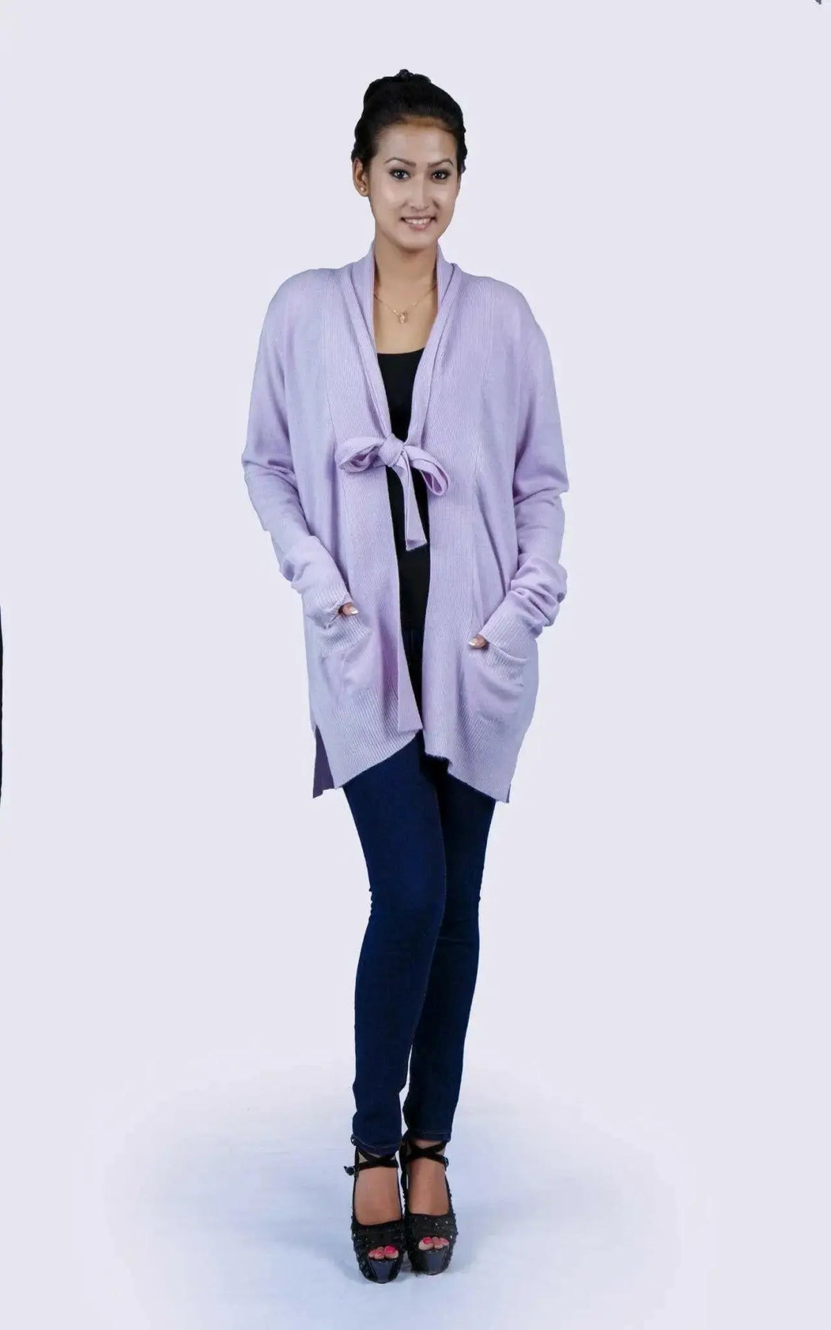 Woman wearing luxurious purple shawl collar pocket cardigan in jeans