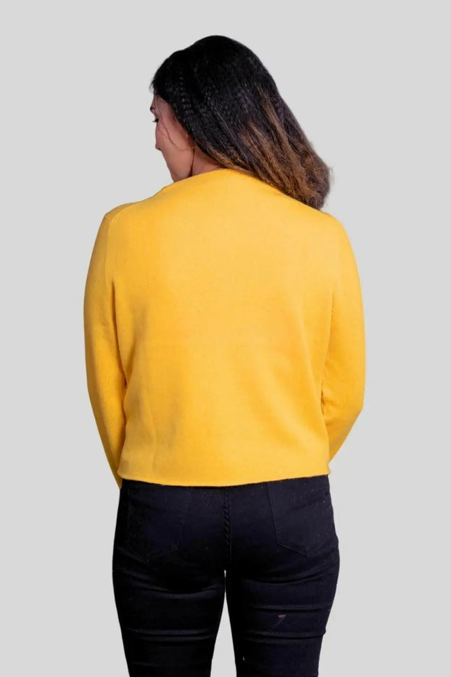 Woman wearing a yellow cashmere cardigan from Luxurious Women’s Cashmere Cardigan collection