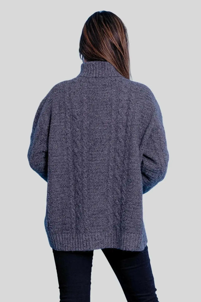 Luxuriously Soft Cashmere Turtle Neck Sweater on woman in grey sweater and black jeans