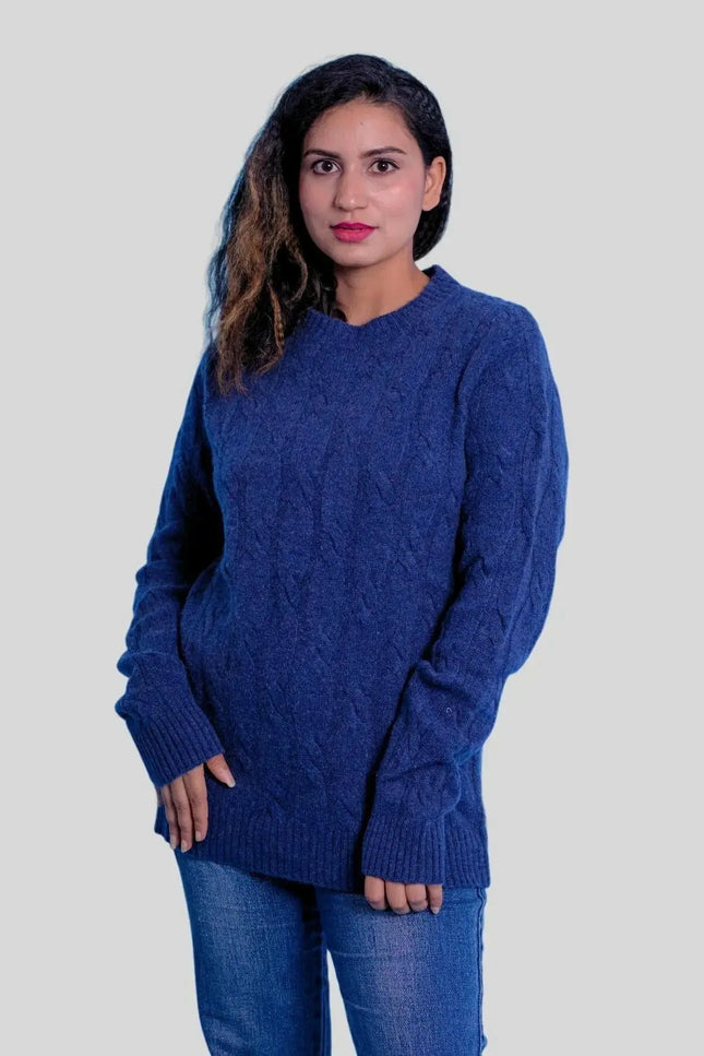 a woman standing next to a man in a blue sweater 