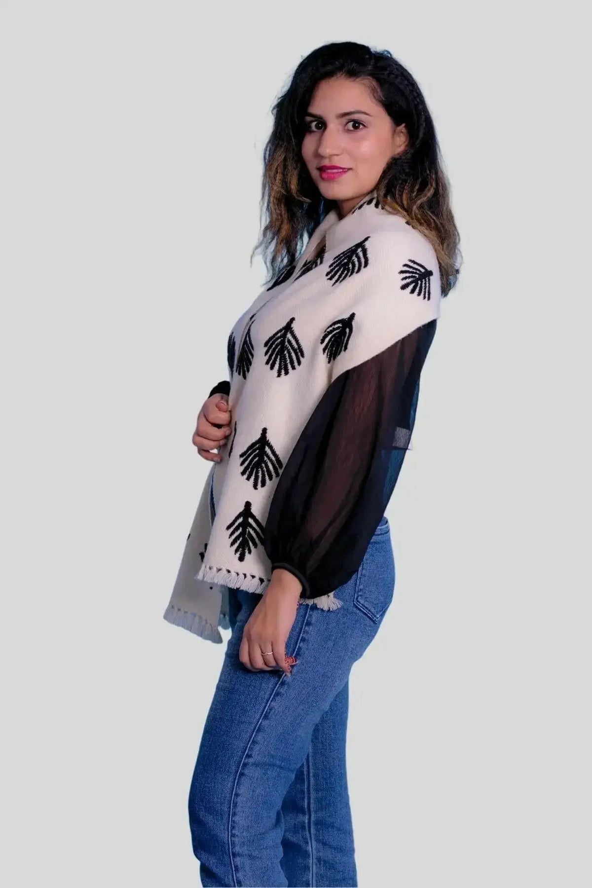 Woman wearing a luxury Italian cashmere scarf with hand embroidery