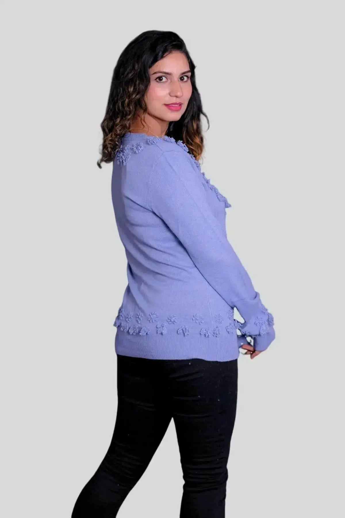 Woman in blue sweater and black jeans modeling Luxury Cashmere V-Neck Pullover | Italian Cashmere